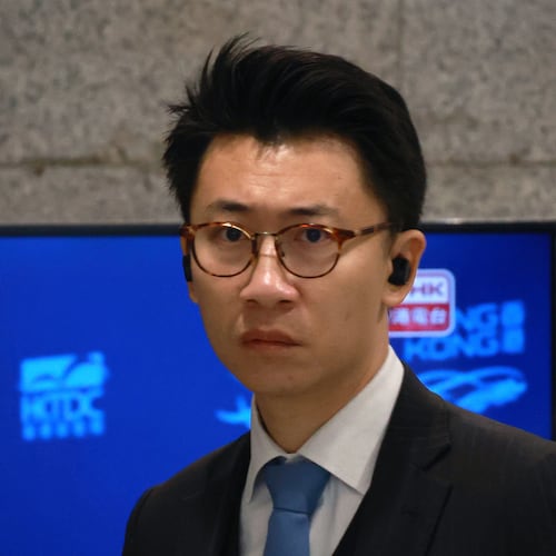 FILE - Senior counsel Benson Tsoi, for Dow Jones Publishing Co (Asia), arrives at Eastern Magistrates' Court to proceed a private prosecution brought by former Wall Street Journal employee Selina Cheng against the paper's parent company, Dow Jones Publishing Co (Asia), in Hong Kong on Dec 18, 2025. (AP Photo/May James, File)