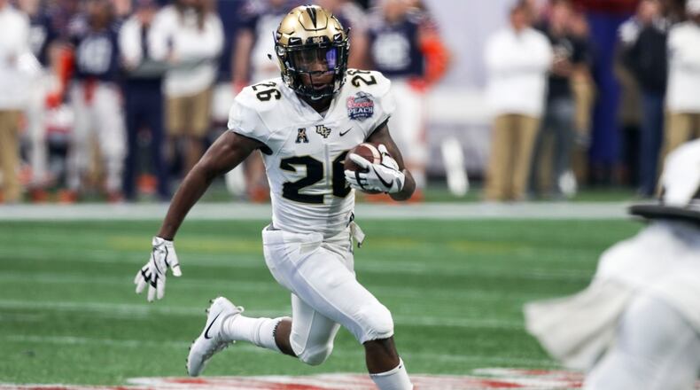 01/01/2018 -- Atlanta, GA, - UCF Knights wide receiver Otis Anderson (26) carries the ball during the first half of the Chick-fil-A Peach Bowl at Mercedes-Benz Stadium, Monday, January 1, 2018.  ALYSSA POINTER/ALYSSA.POINTER@AJC.COM