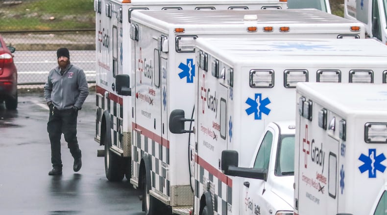 Grady ambulance crew prepare to begin their day on Friday, Jan. 8, 2021. The third wave of coronavirus infections has put Georgia's health care systems under strain. (John Spink / John.Spink@ajc.com)