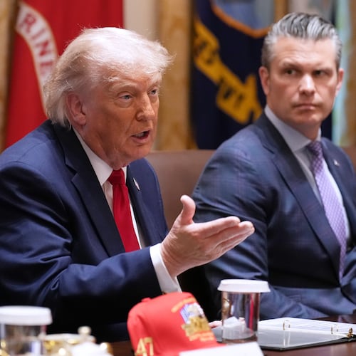 President Donald Trump speaks during a Cabinet meeting at the White House, Wednesday, May 27, 2026, in Washington, as Secretary of Defense Pete Hegseth, looks on. (AP Photo/Jacquelyn Martin)