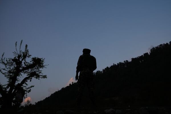 An Indian security officer stand guard near Pahalgam in south Kashmir after assailants indiscriminately opened fired at tourists visiting Pahalgam, Indian controlled Kashmir, Tuesday, April 22, 2025.(AP Photo/Dar Yasin)