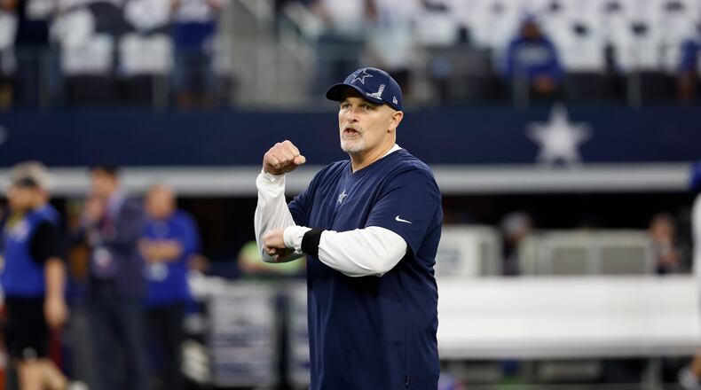 Dallas Cowboys defensive coordinator Dan Quinn watches warmups before an NFL football game against the New York Giants in Arlington, Texas, Sunday, Oct. 10, 2021. (AP Photo/Ron Jenkins)