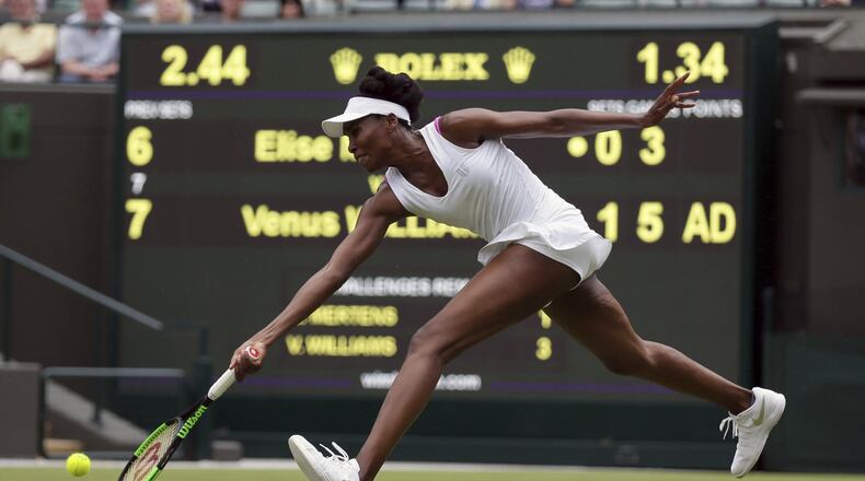 Venus Williams of the United States returns to Belgium’s Elise Mertens during their Women’s Singles Match on day one at the Wimbledon Tennis Championships in London Monday, July 3, 2017. (AP Photo/Tim Ireland)
