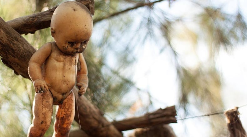 An eerie hanging doll display pictured here in Mexico is a tourist attraction, but a similar display at a home in Plymouth, Mich., prompted police complaints. The display was removed.