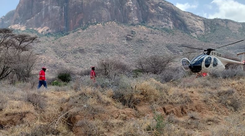 This photo provided by Kenya Red Cross shows Kenya Red Cross emergency response teams during a multi-agency rescue and recovery operation in response to a helicopter crash near Mt. Ololokwe in Samburu, Kenya, Wednesday, Aug. 19, 2026. (Kenya Red Cross via AP) ADDITION: Removes reference to killed tourists