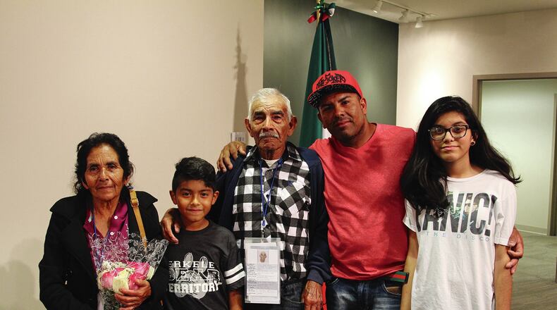Carlos Juárez Acosta (right-center) was separated from his family for 14 years. He’s shown here with his children and parents. Samantha Díaz Roberts/MundoHispanico