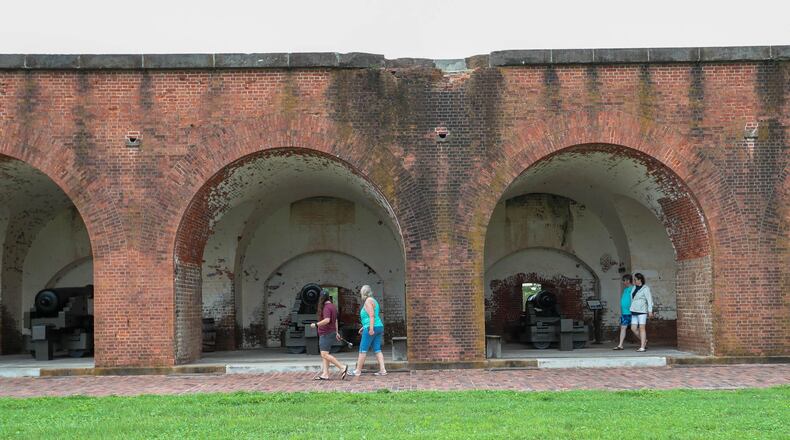 Visitors walk around cannon at Fort Pulaski National Monument. (Photo Courtesy of Richard Burkhart/Savannah Morning News)