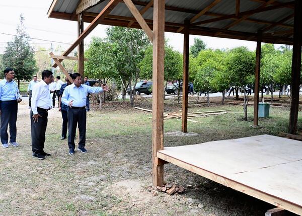 In this photo provided by Myanmar Military True News Information Team on April 18, 2025, Myanmar military chief Senior Gen. Min Aung Hlaing, third from left, inspects construction site for temporary government office in Naypyitaw, Myanmar, the country's capital. (Myanmar Military True News Information Team via AP)