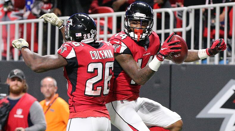 Falcons wide receiver Justin Hardy celebrates his touchdown catch with running back Tevin Coleman to take a 17-7 lead over the Cowboys during the third quarter in a NFL football game on Sunday, November 12, 2017, in Atlanta. Curtis Compton/ccompton@ajc.com