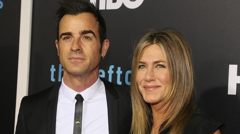 Justin Theroux and Jennifer Aniston arrive for the season two premiere of "The Leftovers" at the Paramount Theatre on Saturday, Oct. 3, 2015, in Austin, Texas.