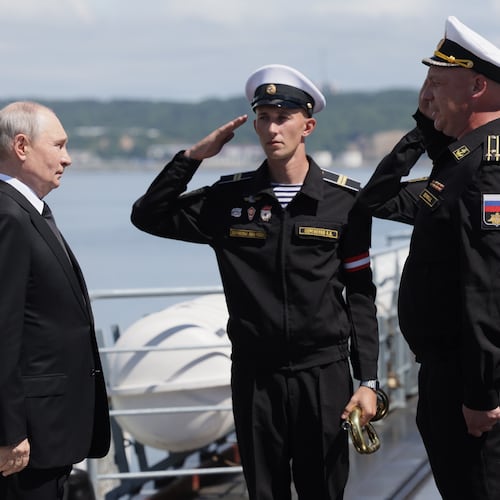 Russian President Vladimir Putin, left, visits the Varyag missile cruiser of the Pacific Fleet to watch a military exercise near Yuzhno-Sakhalinsk, on Sakhalin Island, Russia, Wednesday, Aug. 12, 2026. (Gavriil Grigorov, Sputnik, Kremlin Pool Photo via AP)