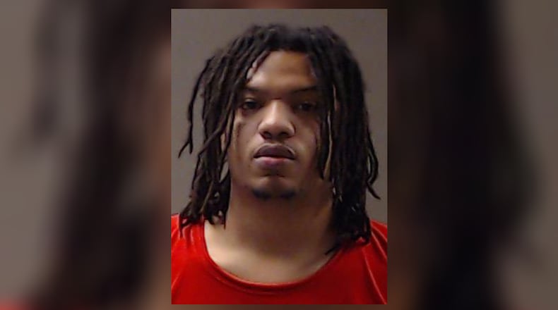 Cecil Adkison, 23, is charged with murder in the August shooting of a 14-year-old boy.