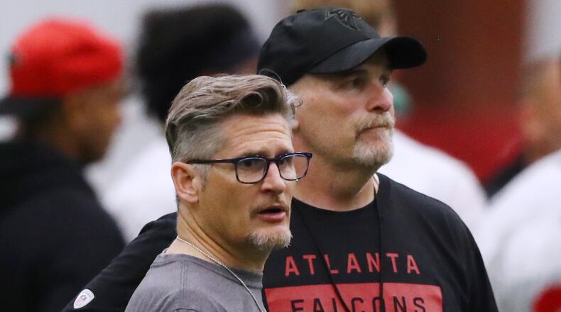 Falcons general manager Thomas Dimitroff and head coach Dan Quinn watch over the second day of rookie minicamp on Saturday, May 11, 2019, in Flowery Branch. Curtis Compton/ccompton@ajc.com