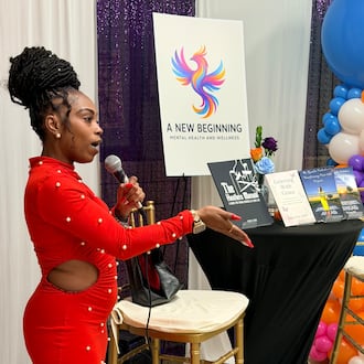 Jamie Kirk, founder of A New Beginning Mental Health & Wellness, speaks to the crowd at a launch party on Tuesday, Nov. 18, 2025, at the Little Five Points Community Center in Atlanta. (Courtesy of Jamie Kirk)