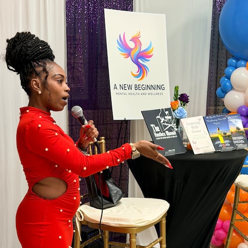 Jamie Kirk, founder of A New Beginning Mental Health & Wellness, speaks to the crowd at a launch party on Tuesday, Nov. 18, 2025, at the Little Five Points Community Center in Atlanta. (Courtesy of Jamie Kirk)