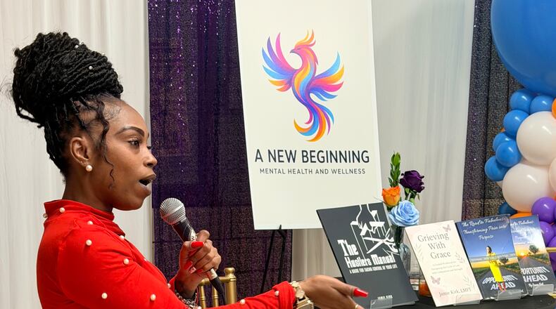 Jamie Kirk, founder of A New Beginning Mental Health & Wellness, speaks to the crowd at a launch party on Tuesday, Nov. 18, 2025, at the Little Five Points Community Center in Atlanta. (Courtesy of Jamie Kirk)