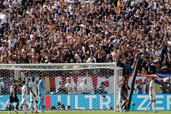 PSG fans cheer their team during the Club World Cup semifinal soccer match between PSG and Real Madrid in East Rutherford, N.J., Wednesday, July 9, 2025. (AP Photo/Adam Hunger)