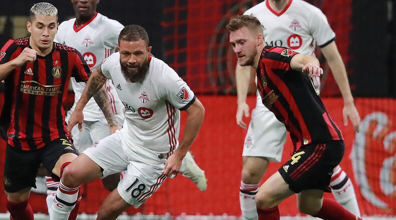 October 30, 2019 Atlanta: Toronto FC midfielder Nick DeLeon takes the ball away from Atlanta United midfielder Julian Gressel (right) and scores the winning goal for a 2-1 victory in the Eastern Conference Final on Wednesday, October 30, 2019, in Atlanta. Curtis Compton/ccompton@ajc.com