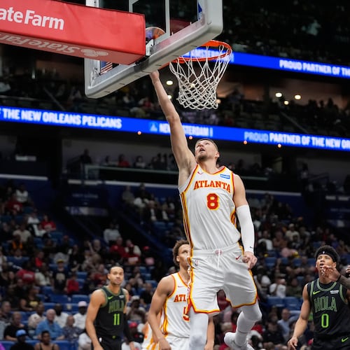 Atlanta Hawks center Kristaps Porzingis (8) goes to the basket against the New Orleans Pelicans in the second half of an NBA basketball game, Saturday, Nov. 22, 2025, in New Orleans. (AP Photo/Gerald Herbert)