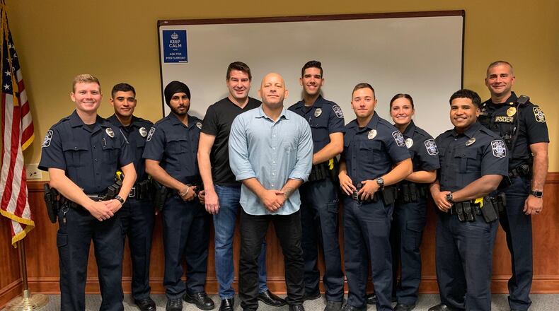 Marietta police are partnering with Borges BJJ and Fitness on Canton Road in Marietta for Brazilian jiujitsu training. Here, from left, are officer Ayers, officer Valdez, officer Singh, coach DJ Farmer, Borges BJJ and Fitness owner Humberto Beto Borges, officer Eister, officer M. Rivera, officer Haas, officer C. Rivera and Major King.