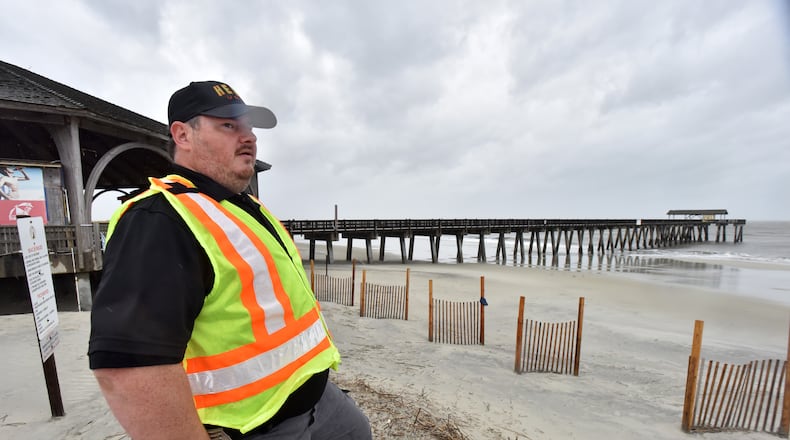 Andy Martz, with GDOT H.E.R.O. Unit, surveys near Tybee Island Pier on Thursday, September 5, 2019. Hurricane Dorian has toppled trees and knocked out power to more than 15,000 customers in this region, including more than half of those on Tybee Island.