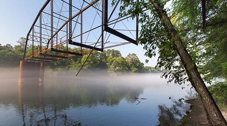 Jones Bridge over the Chattahoochee River in Johns Creek, before it collapsed in January. Residents were invited to share their memories of the Chattahoochee and other locations in the city to become part of a mural to be painted inside the Medlock Bridge Road pedestrian tunnel. AJC FILE