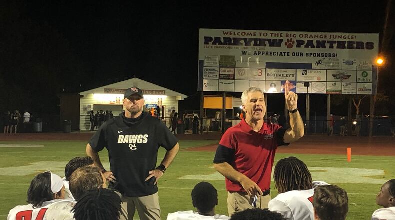 North Gwinnett coach Bill Stewart talks to his team after its 34-27 win over Parkview on Aug. 4, 2021.