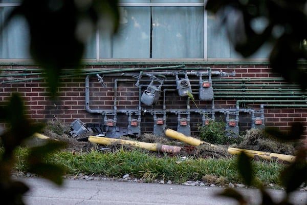Damage is visible after a car crash on West Marietta Street in the Knight Park/Howell Station neighborhood of northwest Atlanta on Monday, Sept. 15, 2025. (Ben Hendren for the AJC)