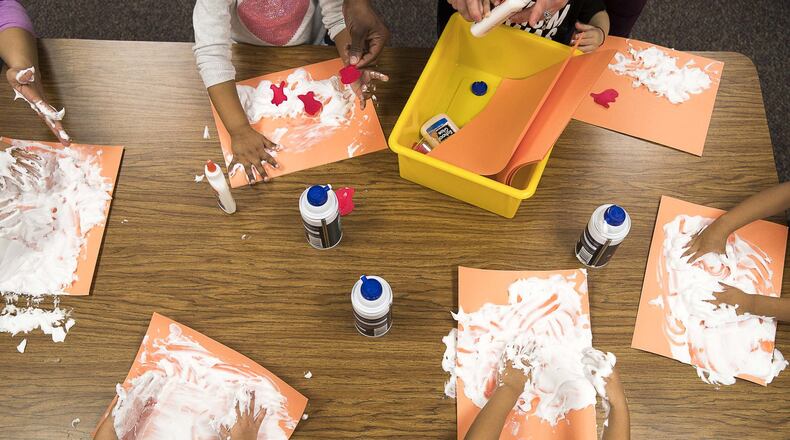 Children participate in a hands-on activity with shaving cream at an early learning program at Winn Holt Elementary School in Lawrenceville on Jan. 16, 2020. In the 2022 school year, Gwinnett County Public Schools will begin offering daily pre-K at eight elementary schools. ALYSSA POINTER/ALYSSA.POINTER@AJC.COM