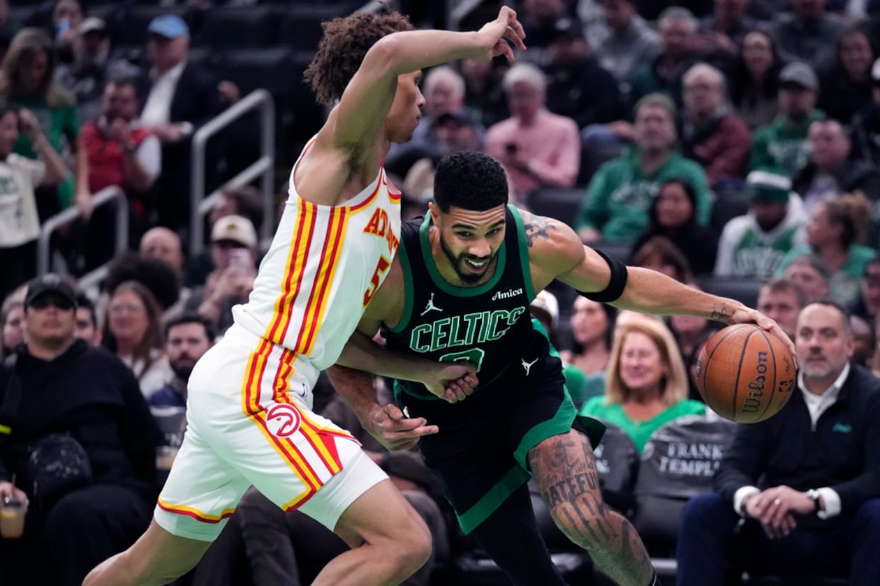 Boston Celtics forward Jayson Tatum drives to the basket against Atlanta Hawks guard Dyson Daniels during the first half of an Emirates NBA Cup basketball game, Tuesday, Nov. 12, 2024, in Boston. (Charles Krupa/AP)