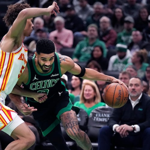Boston Celtics forward Jayson Tatum drives to the basket against Atlanta Hawks guard Dyson Daniels during the first half of an Emirates NBA Cup basketball game, Tuesday, Nov. 12, 2024, in Boston. (Charles Krupa/AP)