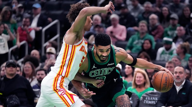 Boston Celtics forward Jayson Tatum drives to the basket against Atlanta Hawks guard Dyson Daniels during the first half of an Emirates NBA Cup basketball game, Tuesday, Nov. 12, 2024, in Boston. (Charles Krupa/AP)