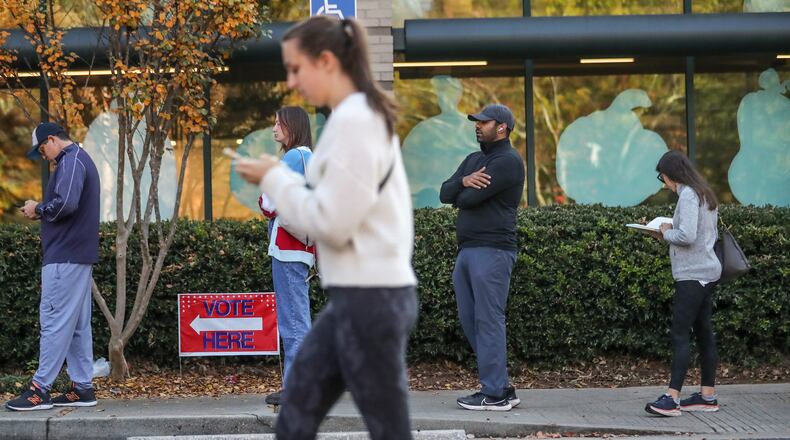Early voters hit the polls Friday, Nov. 4, 2022, at the Joan P. Garner Library at Ponce De Leon in Atlanta. (John Spink / John.Spink@ajc.com)