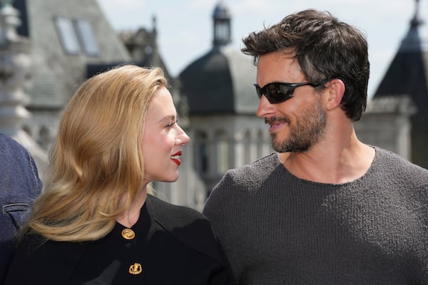 Scarlett Johansson, left, and Jonathan Bailey pose for photographers upon arrival at the photo call for the film 'Jurassic World Rebirth' on Monday, June 16, 2025, in London. (Photo by Scott A Garfitt/Invision/AP)