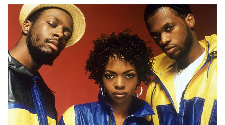 The Fugees pose in this undated photo. Lauren Hill, center, and partners Wyclef Jean and Prakazrel Michel. (AP Photo/Columbia/Marc Baptiste)