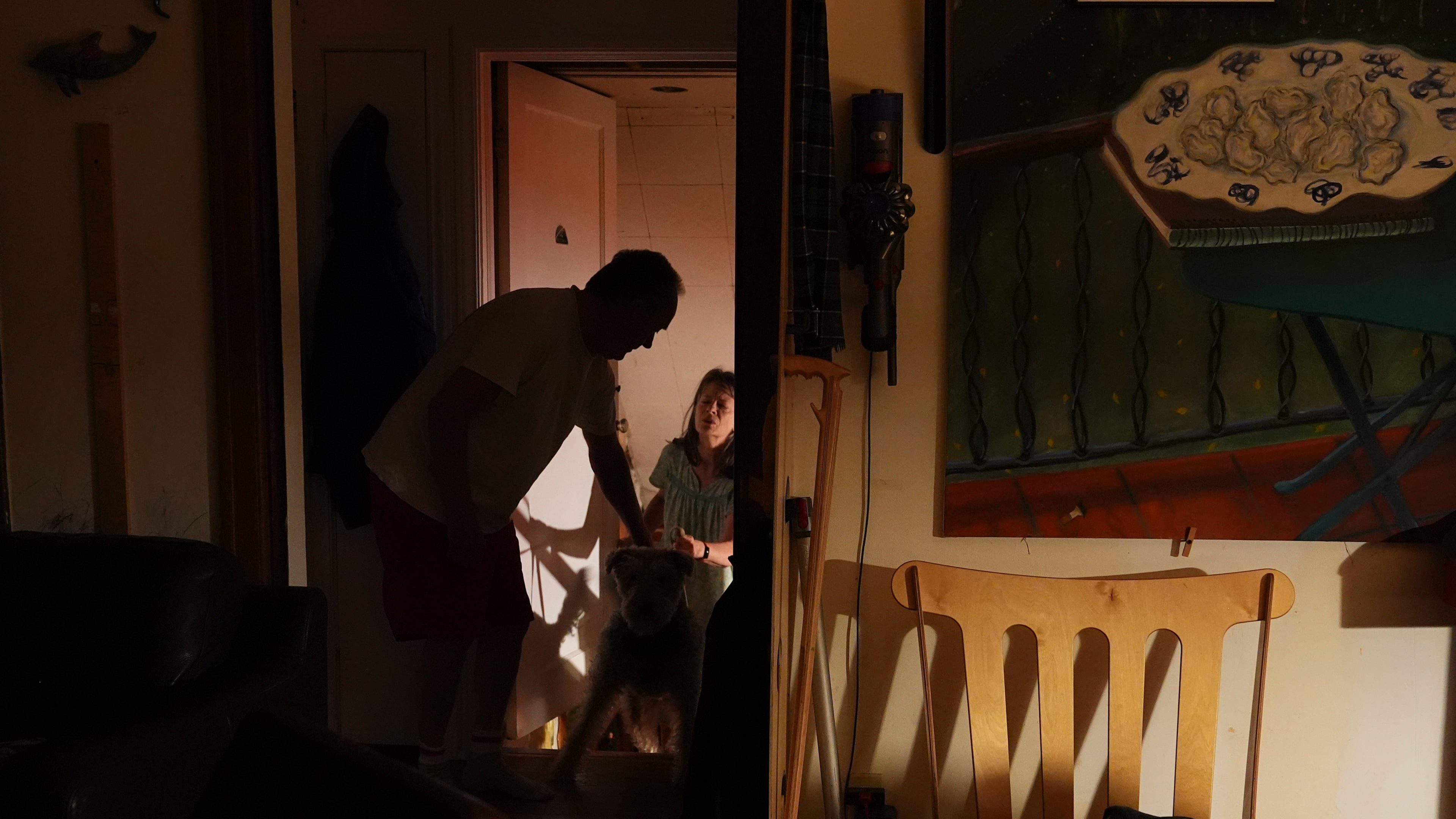 Ross Colquhoun wakes up his wife Mary E. Brunkow to talk about her winning a Nobel Prize in medicine for part of her work on peripheral immune tolerance, in Seattle, Monday, Oct. 6, 2025. (AP Photo/Lindsey Wasson)