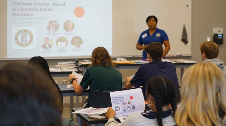 Savannah Country Day students review poll worker training materials at a session led by Chatham County Board of Elections staffer Angela Watkins.