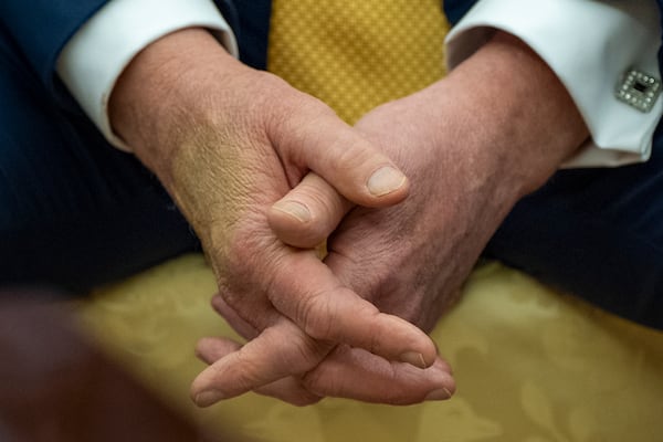 President Donald Trump sits with his hands interlocked as he and Bahrain's Crown Prince Salman bin Hamad Al Khalifa speak in the Oval Office of the White House, Wednesday, July 16, 2025, in Washington. (AP Photo/Alex Brandon)
