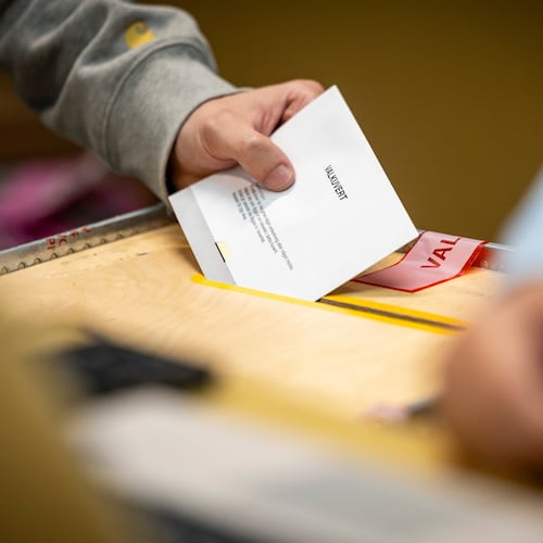 A ballot envelope is placed in a ballot box at a polling station at the City Hall in Malmo, Sweden, Sunday, Sept. 13, 2026. (Johan Nilsson/TT News Agency via AP)
