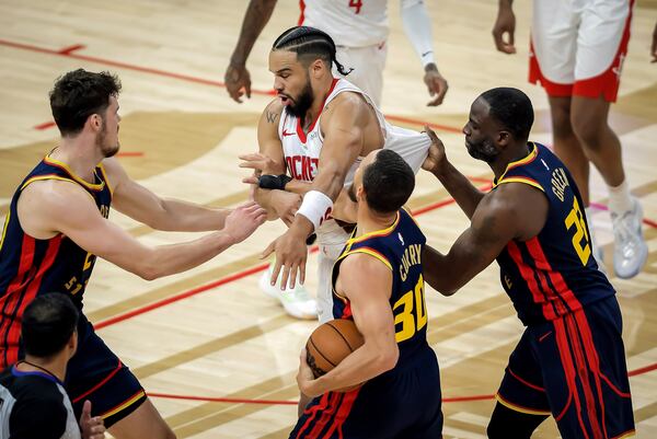 Houston Rockets' Dillon Brooks gets in a shoving match with Golden State Warriors players during the first half in Game 4 of an NBA basketball first-round playoff series in San Francisco, on Monday, April 28, 2025. (Carlos Avila Gonzalez/San Francisco Chronicle via AP)