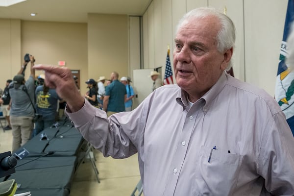 Kerr County Judge Rob Kelly speaks to members of the media following a press conference held by Gov. Greg Abbott discussing the ongoing search and rescue efforts after recent flooding along the Guadalupe River on Saturday, July 5, 2025, in Kerrville, Texas. (AP Photo/Rodolfo Gonzalez)
