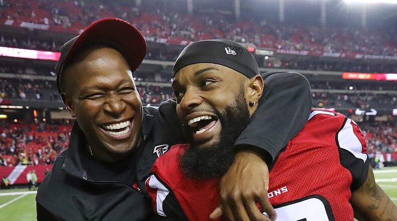 *** POSSIBLE VISUAL LEDE *** January 14, 2017, Atlanta: Falcons wide recievers coach Raheem Morris and wide receiver Justin Hardy celebrate a 36-20 victory over the Seahawks in a NFL football NFC divisional playoff game on Saturday, Jan. 14, 2017, in Atlanta. Curtis Compton/ccompton@ajc.com