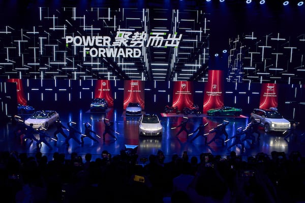 Performers take part in the Volkswagen Group media night ahead of the Auto Show in Shanghai, Tuesday, April 22, 2025. (AP Photo/Ng Han Guan)