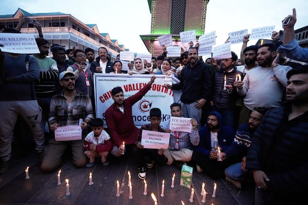 People participate during a candlelight protest after tourists were killed in Srinagar, Indian controlled Kashmir, Wednesday, April. 23, 2025. (AP Photo/Mukhtar Khan)