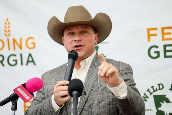 Commissioner of Agriculture Tyler J. Harper delivers remarks at the Wild Hog supper, the traditional kickoff to the legislative session in Atlanta, on Sunday, Jan. 11, 2026.(Miguel Martinez/AJC)