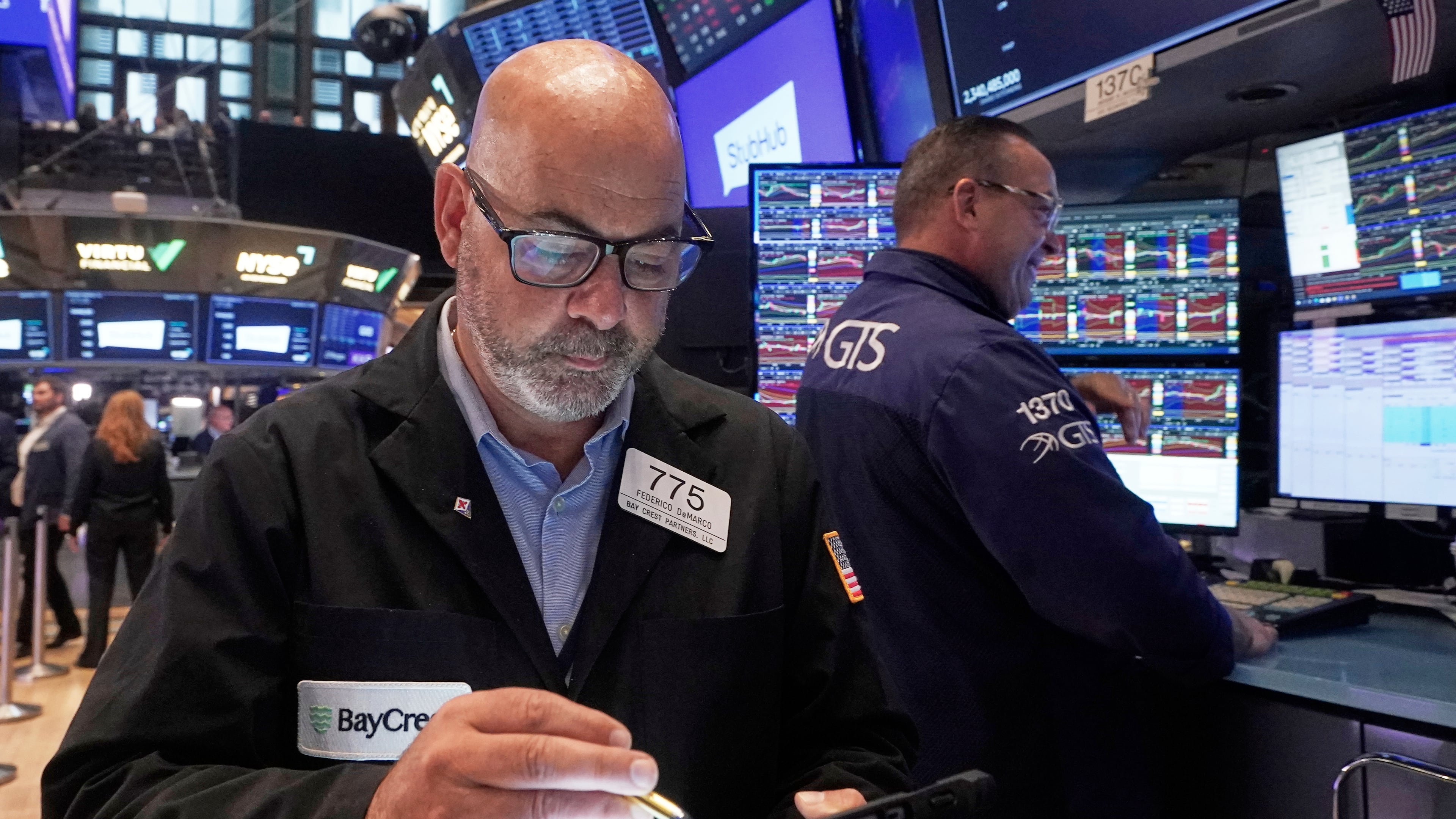 Trader Fred Fred Demarco, left, works on the floor of the New York Stock Exchange, Wednesday, Sept. 17, 2025. (AP Photo/Richard Drew)