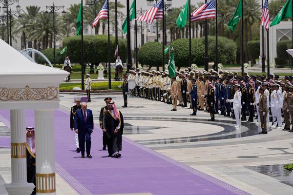 President Donald Trump and Saudi Crown Prince Mohammed bin Salman walk during an arrival ceremony at the Royal Palace in Riyadh, Saudi Arabia, Tuesday, May 13, 2025. (AP Photo/Alex Brandon)