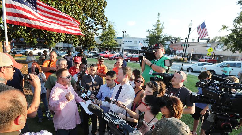 September 13, 2016 COVINGTON Chris Hill, commanding officer of the III% Georgia Security Force, speaks to the news media during a protest against building a mosque in Newton County held on the town square, Tuesday, Sept. 13, 2016, in Covington. Curtis Compton /ccompton@ajc.com