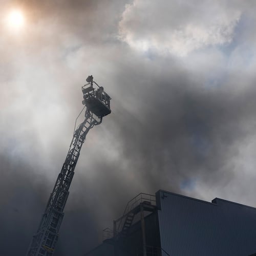 Firefighters put out a fire at warehouse stores after a Russian air attack in Kyiv, Ukraine, Wednesday, Sept. 2, 2026. (AP Photo/Efrem Lukatsky)