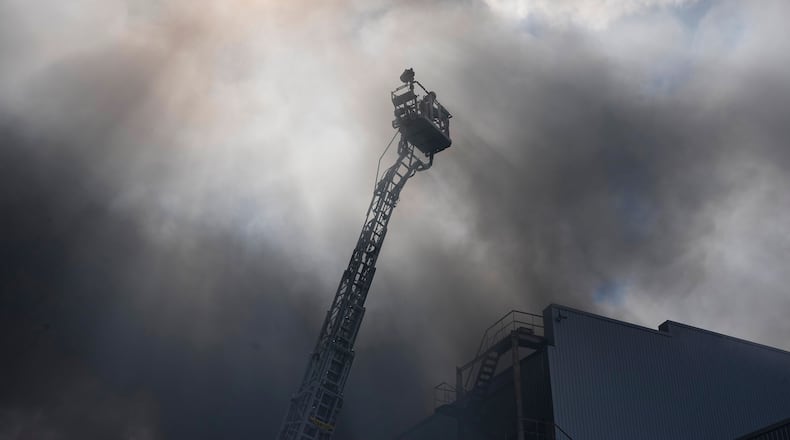 Firefighters put out a fire at warehouse stores after a Russian air attack in Kyiv, Ukraine, Wednesday, Sept. 2, 2026. (AP Photo/Efrem Lukatsky)